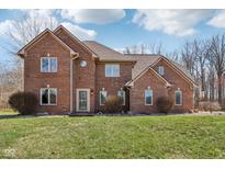 Charming two-story brick home with a well-manicured lawn and a classic, inviting facade at 2525 Sunderland Dr, Martinsville, IN 46151