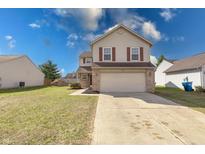 Charming two-story home with red shutters, a two-car garage, and a well-manicured lawn at 2623 E Bristlecone Dr, Indianapolis, IN 46217