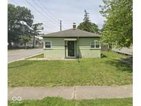 Charming single-story home featuring a well-maintained lawn and inviting curb appeal at 4330 E 16Th St, Indianapolis, IN 46201