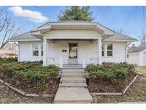 Charming home featuring a welcoming front porch, complemented by lush landscaping and a well-maintained exterior at 497 Hurricane St, Franklin, IN 46131