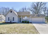 Charming single-story home with a well-manicured lawn and attached two car garage at 53 Knoll Ln, Brownsburg, IN 46112