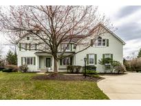Charming two-story home with landscaped yard and a curved driveway leading to the front entrance at 10955 Andrews Pl, Fishers, IN 46037