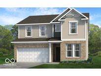 Charming two-story home featuring a brick and siding exterior with an attached two-car garage and neatly landscaped yard at 13752 N George Ct, Camby, IN 46113