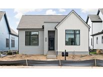 Charming home featuring a blend of brick and white siding, with a welcoming entrance and modern design at 17354 Newton Main St, Westfield, IN 46074