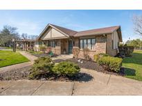 Charming brick home featuring manicured landscaping and inviting curb appeal at 3875 Offshore Dr, Columbus, IN 47203