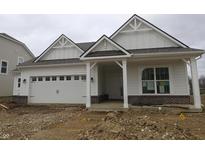 New construction home featuring white siding, brick accents, an attached garage, and covered front porch at 4016 Bozeman Way, Bargersville, IN 46106