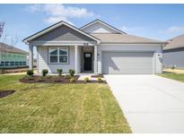 Charming single-story home with a gray exterior, well-manicured lawn, and an attached two-car garage at 5152 Cartland Dr, Indianapolis, IN 46239