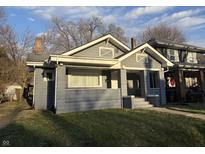 Charming single-Gathering home with a well-maintained lawn and classic architectural details at 1124 Victory Ct, Anderson, IN 46016
