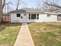 Cozy one-story home with a walkway leading to the front door and sparse landscaping at 1842 W Kessler Blvd N Dr, Indianapolis, IN 46228