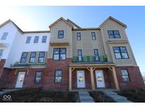 New construction townhome with brick facade and covered entryways at 7081 Pate Hollow Dr, Brownsburg, IN 46112