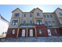 New construction townhome featuring brick and siding exterior with covered entry at 7089 Pate Hollow Dr, Brownsburg, IN 46112