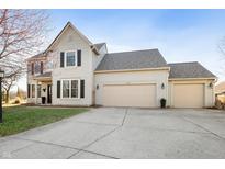 Charming two-story home with a three-car garage and well-maintained lawn at 10234 Chamomile Ct, Noblesville, IN 46060