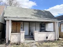 Exterior of a home featuring a covered front porch and visible house number at 1437 Kappes St, Indianapolis, IN 46221