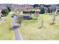 Expansive property with a charming brick home, detached garage, and a long driveway at 195 Hess Rd, Martinsville, IN 46151