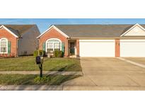 Charming brick home with a well-manicured lawn and attached two-car garage at 198 Rapid Rill Ln, Brownsburg, IN 46112