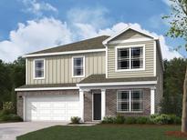 Charming two-story home featuring a brick and siding facade with a two-car garage and well-manicured lawn at 2242 Oakmont Dr, Plainfield, IN 46168