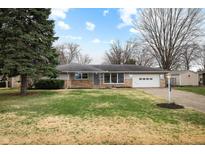 Charming ranch-style home with a well-maintained lawn and a cozy, inviting exterior at 3013 E 7Th St, Anderson, IN 46012