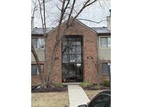 Modern condo building featuring a striking brick facade, large windows, and well-maintained landscaping at 4470 Village Ln # 3, Indianapolis, IN 46254