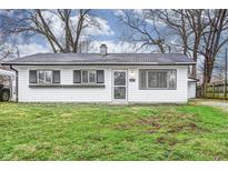 Charming single-story home boasts a white exterior and well-maintained front lawn at 6 Helena Ct, Indianapolis, IN 46222