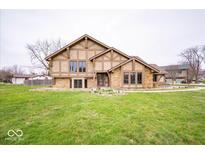 Beautiful two-story home boasting a lush green lawn and unique stone and stucco facade at 960 Carmen Ct, Greenwood, IN 46143