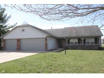 Charming single-story home featuring a two-car garage and a well-maintained front yard at 2350 S Ashley Dr, Greenfield, IN 46140