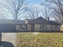 Charming single story ranch-style home with stone facade and attached garage at 2843 Questend S Dr, Indianapolis, IN 46222