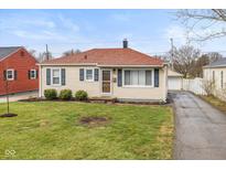 Charming one-story home featuring a well-maintained lawn and cozy curb appeal at 420 N 15Th Ave, Beech Grove, IN 46107