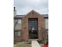 Brick building entrance featuring large glass windows and visible unit number at 4480 Village Ln # 2, Indianapolis, IN 46254