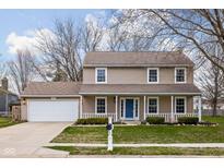 Charming two-story home featuring a well-manicured lawn and an inviting front porch at 464 Hyannis Dr, Avon, IN 46123