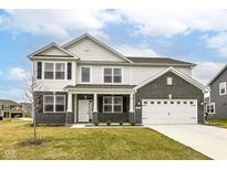 Two-story home featuring a modern facade, attached garage, and well-maintained lawn at 5761 Handbell Ln, Greenwood, IN 46143