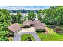 Charming single-Gathering home with a three-car garage and circular driveway near a scenic lake view at 22 Point Ln, Arcadia, IN 46030