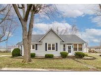 Charming single-story home with gray siding, neat landscaping, and a welcoming front entrance at 502 E Washington St, Summitville, IN 46070