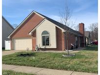 Charming single-story home with brick facade, attached garage, manicured lawn, and inviting curb appeal at 906 Claiborne Ln, Lebanon, IN 46052