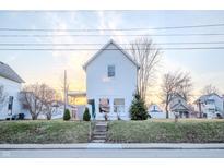 Charming two-story home with a small, well-manicured front yard and inviting curb appeal at 2639 Central Ave, Anderson, IN 46016