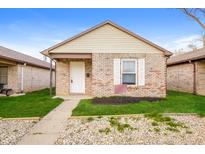 Charming brick single-story home with well-maintained lawn and inviting entrance at 5010 Elliott Ave, Indianapolis, IN 46201