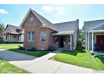 Charming brick home featuring a well-manicured lawn and inviting walkway at 540 S Marion St, Martinsville, IN 46151