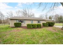 Charming one-story home featuring lush landscaping and a well-maintained front yard at 2072 S Rembrandt Cv, Martinsville, IN 46151