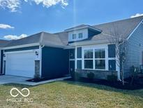 Charming home showcasing clean lines, light-filled windows, and a well-maintained yard on a sunny day at 19350 Goins Blvd, Westfield, IN 46074