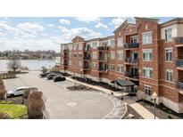 Beautiful condo building with red brick, balconies, and lake view offers ample parking and convenient amenities at 20971 Shoreline Ct # Apt 212, Noblesville, IN 46062