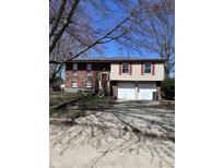 Charming two-story home with brick and siding, red shutters, and a two-car garage at 7802 Broadview Dr, Indianapolis, IN 46227