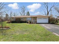 Charming single-story home featuring a stone facade, attached garage, and well-maintained front yard at 110 Jordan Ct, Martinsville, IN 46151
