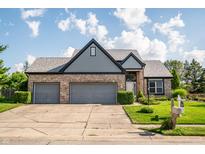 Charming brick home with two-car garage and well-maintained landscaping at 11229 Echo Ridge Ln, Indianapolis, IN 46236