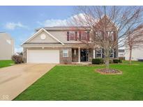 Charming two-story home with brick and siding exterior, well-manicured lawn and attached two-car garage at 1464 Hession Dr, Brownsburg, IN 46112