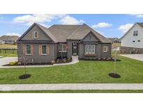 Charming single-Gathering home boasting a well-manicured lawn and inviting curb appeal at 18271 Lake Winds Dr, Westfield, IN 46074