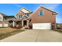 Charming two-story brick home with a stone entryway and attached two-car garage at 643 Bracknell Dr, Avon, IN 46123