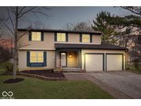 Charming two-story home featuring a two-car garage, neutral siding and complemented by a well-manicured lawn at 6602 Boston Ridge Ct, Indianapolis, IN 46237