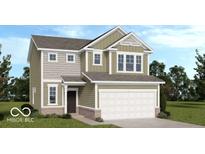 Charming two-story home with a two-car garage, siding, and professionally landscaped yard at 1956 Black Oak Dr, Shelbyville, IN 46176