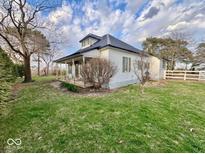 Charming home with a covered porch and a well-maintained lawn, perfect for outdoor relaxation at 2275 N 250 E, Lebanon, IN 46052