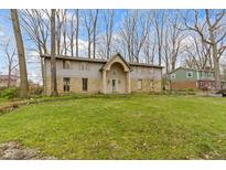 Charming home featuring a stone and siding facade with a well-manicured lawn at 4140 Melbourne Rd, Indianapolis, IN 46228