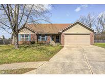 Charming one-story brick home with attached garage and well-maintained front yard at 6036 Maple Forge Cir, Indianapolis, IN 46254